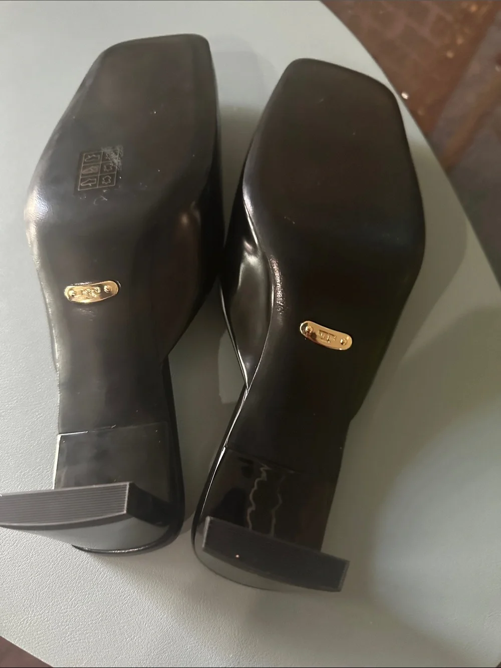 Tory Burch Black Leather Slide Mules with Gold Round Emblem
